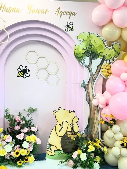 Pooh Bear looking at his honey pot, a classic and heartwarming scene that we brought to life with custom cutouts.