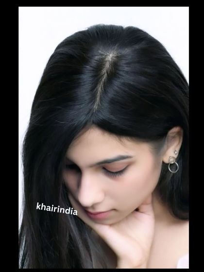 A beautiful studio shot highlighting the natural parting of one of our silk base toppers. This is the level of detail and realism we strive for in every piece.