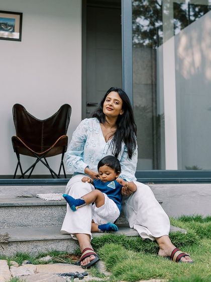 A relaxed moment on the steps during a first birthday celebration. I capture both the big moments and the quiet, in-between ones that make up your day.