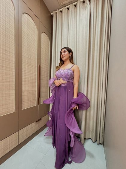 The organza ruffles on this saree create beautiful movement and texture. It's a statement piece that is sure to turn heads at any wedding or cocktail party.