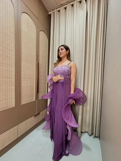 The organza ruffles on this saree create beautiful movement and texture. It's a statement piece that is sure to turn heads at any wedding or cocktail party.