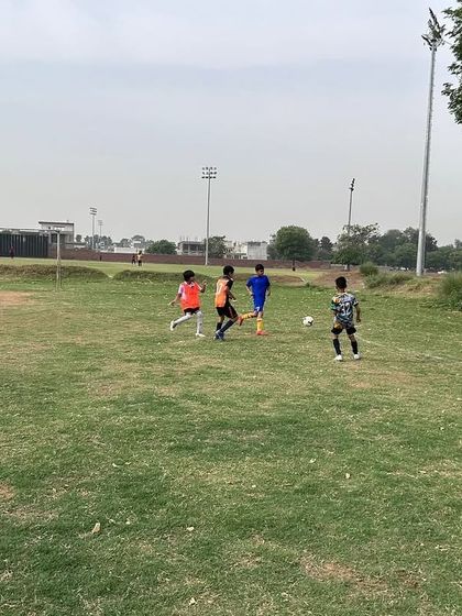 Action near the goal during a U11 Junior League match.