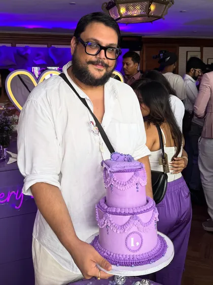 It’s me, the Chubby Baker, with a mini version of a tiered cake we made for a corporate celebration. Being a part of a brand's success story is always a pleasure, and it’s great to put a face to the cakes you love.