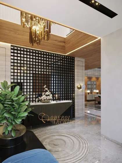 A modern entryway with a dramatic black grid partition, a skylight with a cascading chandelier, and a mix of marble and wood textures.
