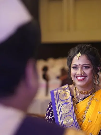 A sweet moment between the bride and groom. Her makeup looks flawless from every angle, ensuring she is picture perfect throughout her wedding day.
