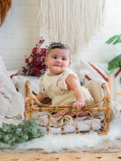 A wonder girl indeed. This baby girl's confident pose and sweet expression show off her budding personality.