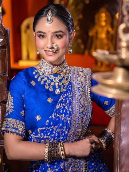 This shot captures the regal aura of the bride. The makeup is designed to be timeless, ensuring her wedding photos will be cherished forever.