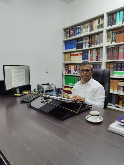At my desk in the office, where I spend countless hours on case preparation, strategy development, and legal research for my clients.