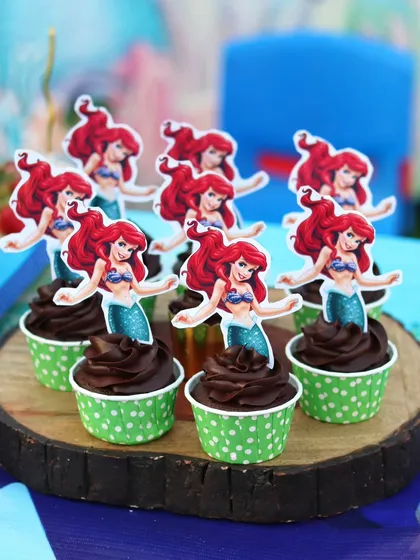 Little Mermaid themed chocolate cupcakes with cute Ariel toppers.