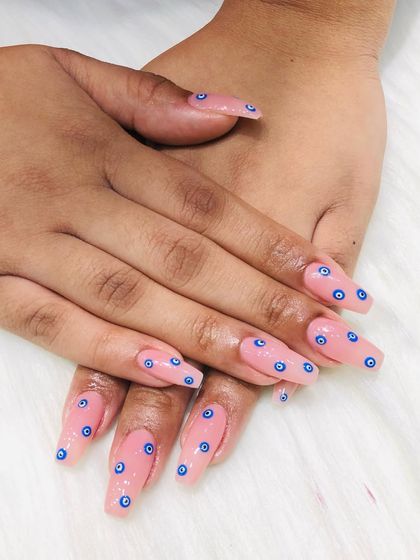 Another view of the evil eye nails, showing the full set.