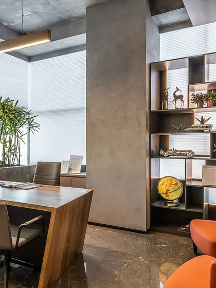 The corporate headquarters for Vedant Dyestuff Intermediate in Mumbai embodies our 'Less is More' philosophy. We integrated biophilic design with a live green landscape to soften the minimalist concrete and wood palette, creating a workspace that is both productive and serene. The design balances rustic textures with the gloss of marble for a touch of quiet flamboyance.