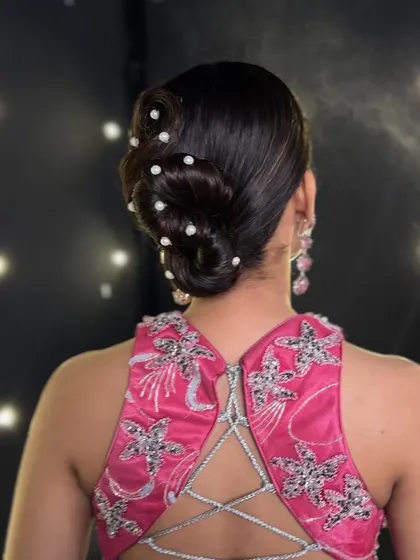 Here you can see the hairspray setting the style in place. You will learn about the right products and their application to ensure your hairstyles are not only beautiful but also durable and long-lasting.