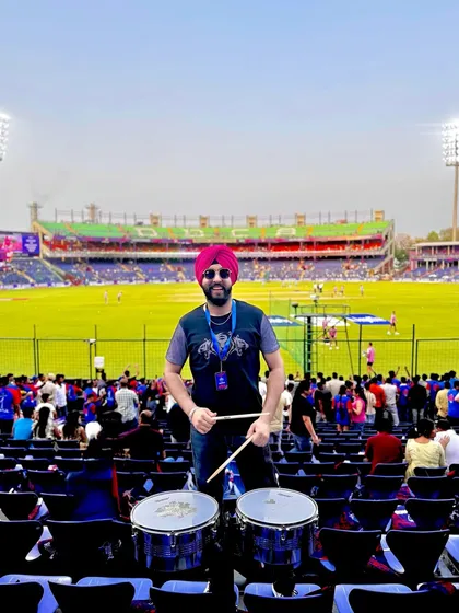 Ready for the decider match. Standing in the stadium with my drums, ready to support the team.
