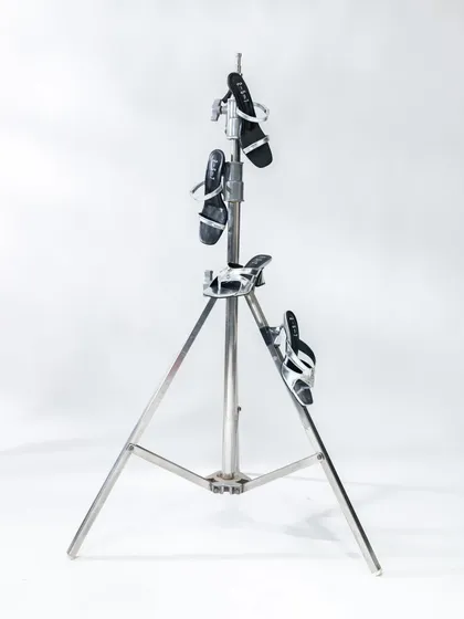 A minimalist product shot, using a simple light stand to display the shoes. Sometimes the simplest ideas are the most effective.