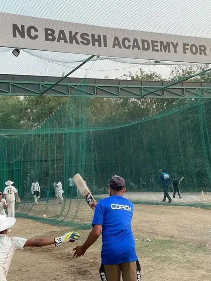 A glimpse into a net session at our Ramjas Sports Complex facility. Here, one of our ICC certified coaches provides direct, hands-on instruction to a young batsman. We focus on getting the fundamentals right, from grip and stance to shot selection.