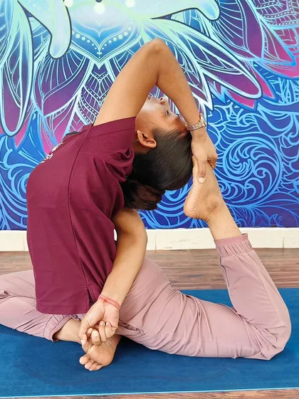 Another variation of the mermaid pose, demonstrating beautiful spinal articulation and hip flexibility.