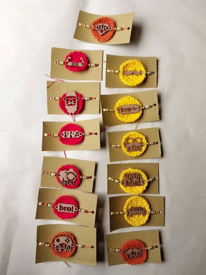 A collection of my crochet MDF rakhis, featuring fun tags like 'Bro', 'Bhai', and 'Swag Wala Bhai'. These are very popular for their quirky style.