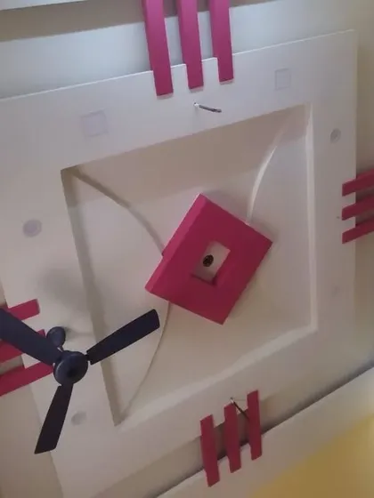 A fun, blocky design in pink and white for a kid's bedroom. This style is playful and modern, and perfectly integrates the ceiling fan.