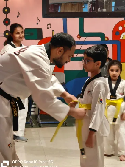 Another one of our little champs earning his yellow belt. The first promotion is always a special one.