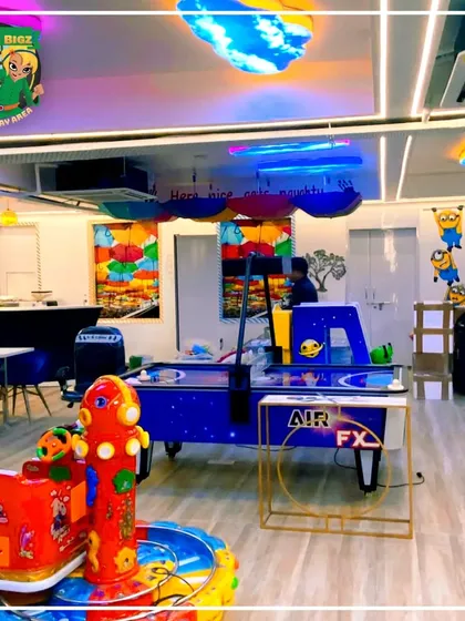 The classic air hockey table sits ready for action, a favorite for both kids and adults looking for some competitive fun.