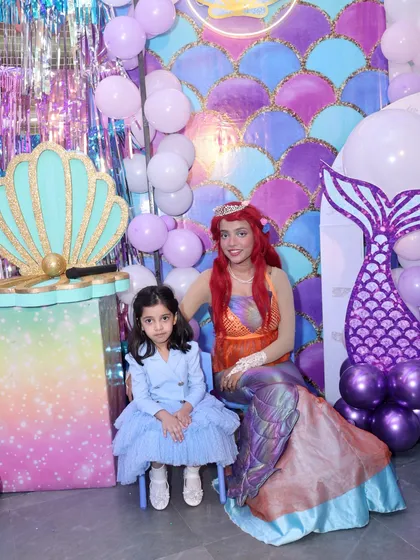 A special moment between the birthday girl and our beautiful mermaid character against the stunning under-the-sea backdrop.