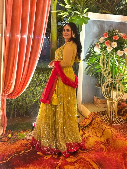 Perfect for a Haldi or Mehendi, this bright yellow lehenga with a contrasting pink border is full of festive cheer.