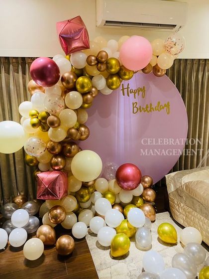 The geometric and confetti balloons add a modern and fun twist to this otherwise soft and romantic color palette.