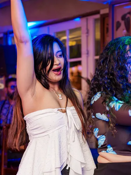 Hands in the air for a classic anthem. The energy at Monkey Bar is electric.