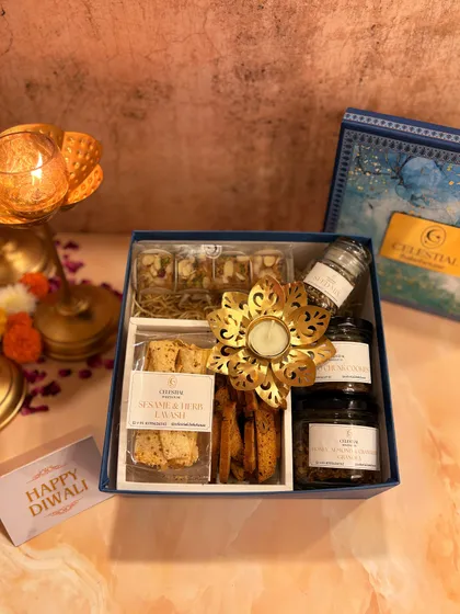 A detailed shot of the 'Illuminating Indulgence' hamper, showing the variety of textures and treats packed inside.