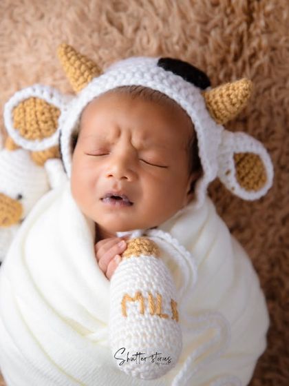 A funny little expression from our sleeping cow, holding his milk bottle prop.