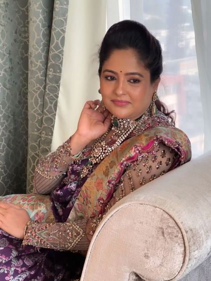 A relaxed portrait of this elegant client. The makeup is soft and flattering, enhancing her natural beauty without looking heavy.