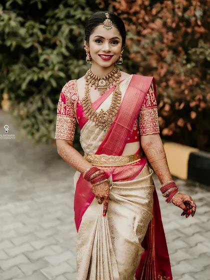 A radiant South Indian bride on her wedding day. My focus is on capturing the elegance of the bridal attire, the intricate details of the jewelry, and the happy glow of the bride.