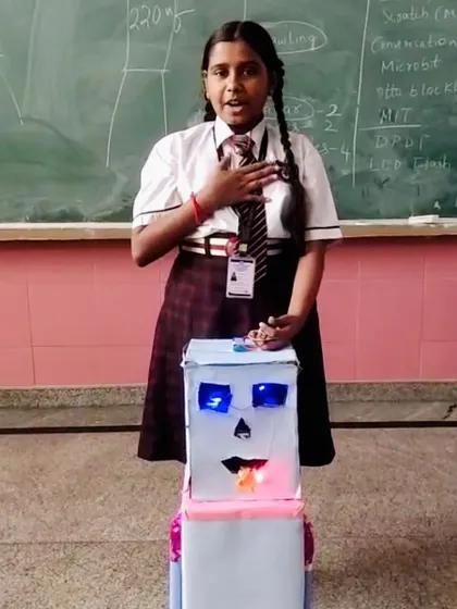 I'm so proud of this fifth-grader, who was inspired by our classes to build this amazing robot on her own. She creatively used logic gates for the eyes and mouth and balanced it on two remote cars, showing how foundational knowledge sparks independent creation.