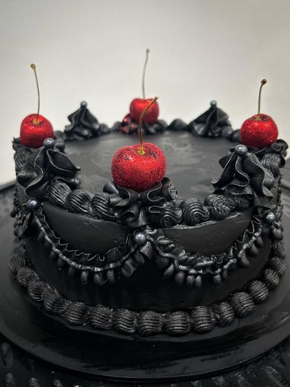 I had so much fun making this retro and gothic cake for a friend. The black-on-black piping with pops of red from the glitter cherries creates a cool, moody vibe. I'd love to make one of these for my own birthday.