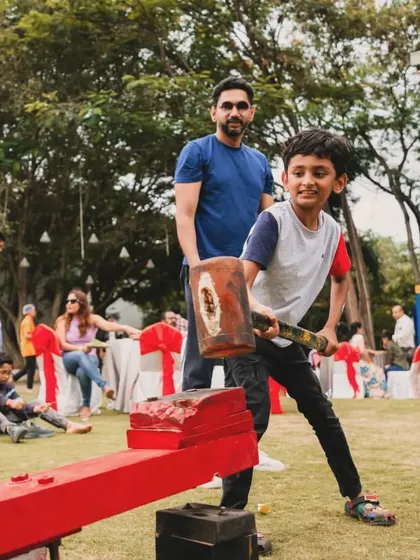I love incorporating interactive games that fit the party's theme. At this Monopoly-themed event, kids got to test their strength with a classic arcade hammer game, adding a fun, carnival-like atmosphere to the celebration.