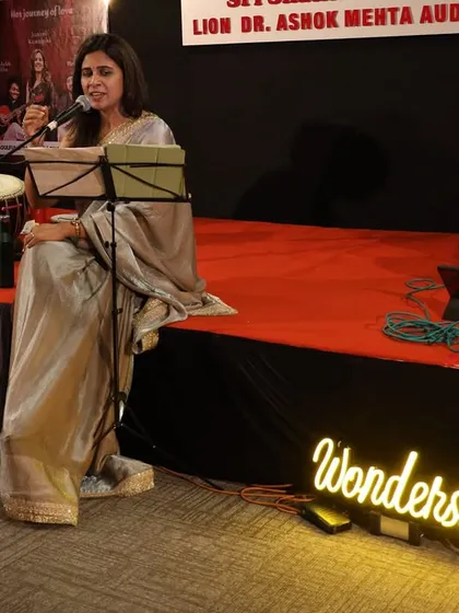 This is from "Phir Le Aayi Dil," one of my curated live music evenings. The warm lighting, the intimate setting with my "Wondershop" sign glowing, and the soulful performance on stage capture the professional yet heartfelt atmosphere I strive to create for music lovers.