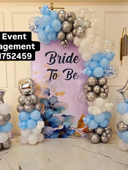 This is another popular 'Bride to Be' decoration, perfect for a sangeet or engagement party. It includes a balloon arch over a floral print backdrop, with matching balloon pillars topped with star-shaped foils for extra sparkle.