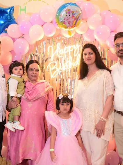 A multi-generational family photo at a birthday party. It's a joy to host celebrations that bring the whole family together.