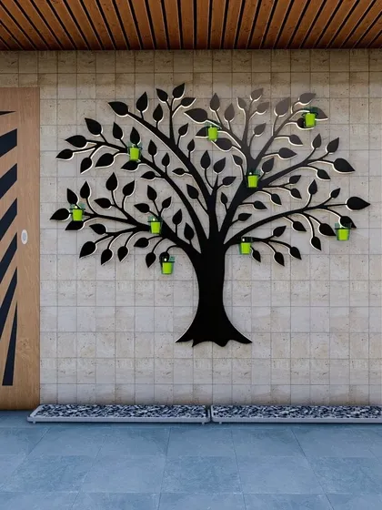 We designed this "Tree of Life" wall planter as a creative way to display plants. The black metal silhouette holds small, vibrant green pots, turning a simple wall into a living art installation.