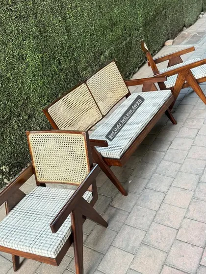 The full Jeanneret style set, including a bench and two chairs.