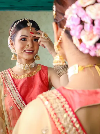 A candid moment of a bride getting ready. The right makeup can be pretty powerful, and it's my job to make you feel that way.