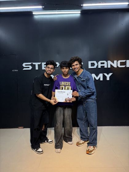 Awarding a certificate for completing our pro training batch. We focus on body movement, foundations, and specific dance styles.