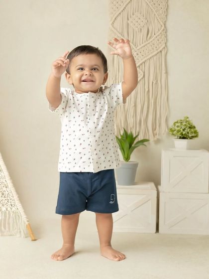 My boho-themed sessions use natural textures like macrame, wood, and greenery to create a calm and earthy setting that beautifully complements your child's simple joy.