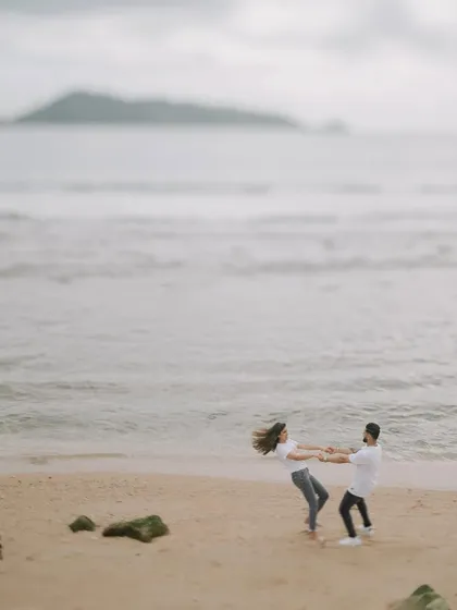 A playful, candid moment as Harman and Komal spin around on a quiet beach in Phuket. These are the fun, natural interactions I love to capture.