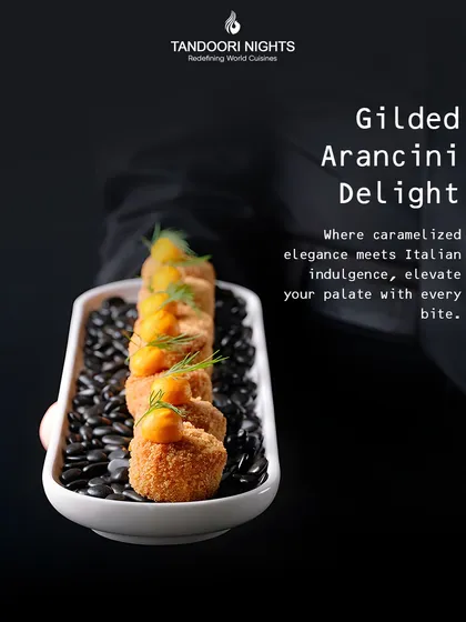 Our Gilded Arancini Delight is where Italian indulgence meets caramelized elegance. These crispy risotto balls are presented on a bed of black seeds, elevating your palate with every bite.