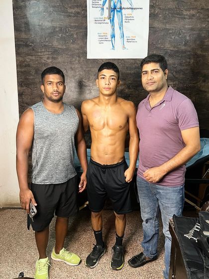 With wrestler Love and his training partner.