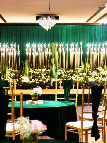 An elegant Sangeet night featuring a rich emerald green palette, sophisticated floral arrangements, and warm ambient lighting. I design each function with its own distinct mood, ensuring a varied and dynamic wedding experience.