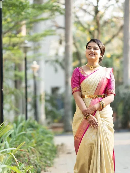 A full-length shot of the bride in a beautiful garden setting. The look is classic and timeless, perfect for a traditional pre-wedding ceremony.