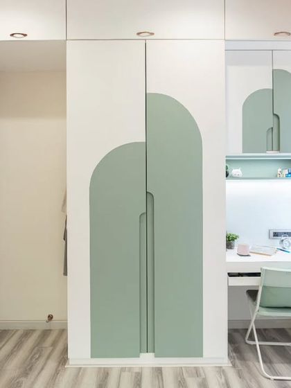 A full view of the custom wardrobe and integrated study unit. This design maximizes storage and functionality in a compact space, perfect for a child's room.