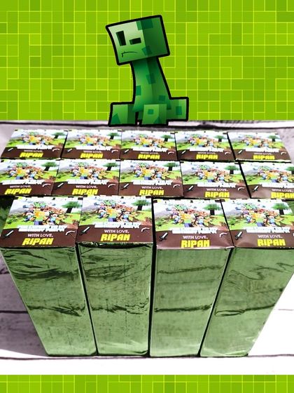 For this Minecraft party, the personalized water bottles were wrapped in green foil paper with a custom "with love from Ripan" sticker.